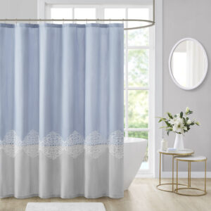 Color block style with a feminine look and feel; The Madison Park Panache shower curtains combines a color block design in light blue and grey hues while a lattice embroidery for a beautiful and delicately