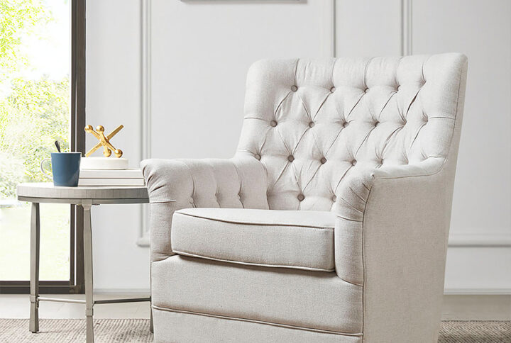 Relax in the comfort and style of the madison park mathis swivel glider chair. This swivel chair is upholstered in a soft fabric with a hand-tufted back to create a traditional look. The swivel glide base allows the chair to rotate 360 degrees