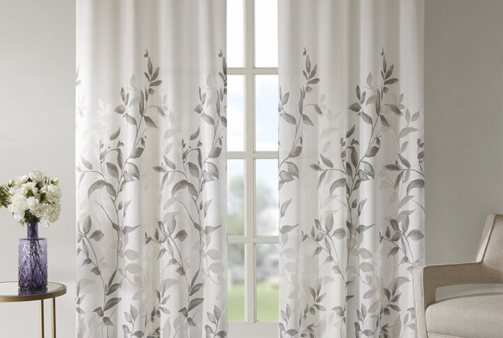 Transform any room with the beauty of our Madison Park Cecily Printed Window Panel. The gorgeous panel flaunts a stunning all over grey botanical design burned out for a dimensional and fresh update. Finished with silver grommet tops for easy hanging