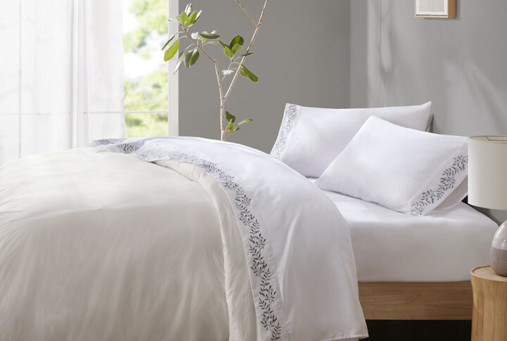 Style your bed with the simple elegance of the Madison Park Embroidered Microfiber Sheets. This solid microfiber sheet set features a beautiful embroidered hem that adds a refined touch and brings a pop of color to your bedroom. Embroidery is featured on the flat sheet and pillowcase hem face side only. The fitted sheet fits mattresses up to 16". Made from ultra-soft microfiber