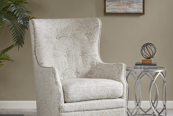 The Madison Park Ella Swivel Glider Chair elegantly combines style and comfort for the perfect addition to your living space. This oversized wingback-style chair features a tonal pattern in a rich cream hue