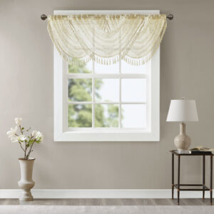 adding grace and charm to your décor. The neutral colors and light fabric helps create a delicate look to soften any room