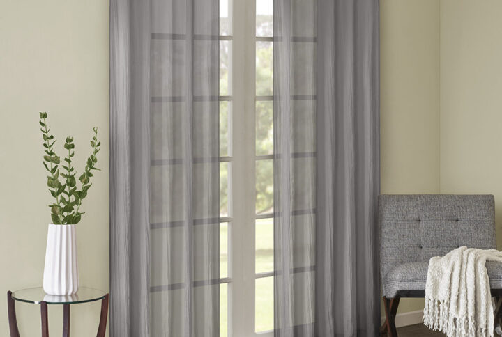 Add a fresh contemporary style to your home with Madison Park’s Harper Solid Crushed Window Panel Pair. Made from a lightweight grey sheer fabric