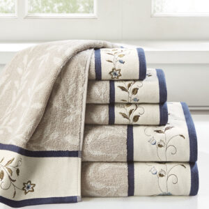 Add a touch of elegance to your bathroom decor with our Madison Park Serene Embroidered Cotton Jacquard 6 Piece Towel Set. These cotton towels feature a jacquard leaf pattern with a floral embroidered hem