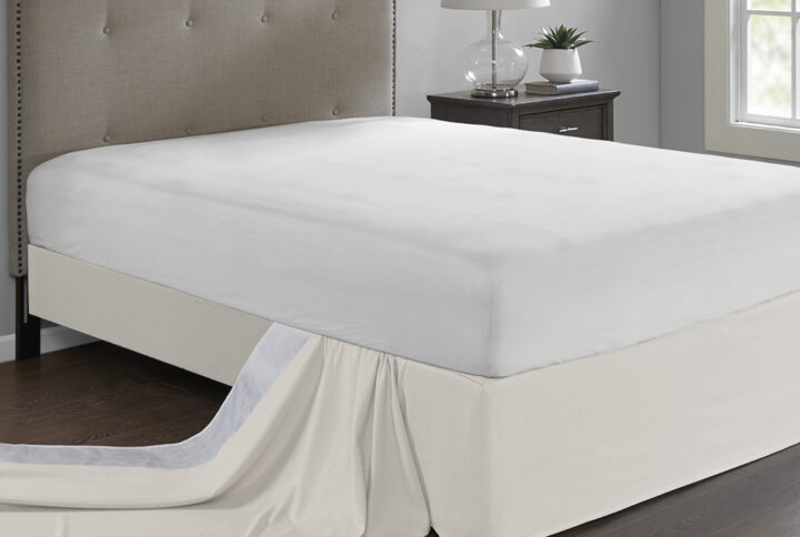 Give your bed the perfect finish with the Madison Park Simple Fit Wrap-Around Adjustable Bed Skirt. The solid ivory bed skirt features a hidden fabric band with a non-skid backing to keep it in place. Simply tuck and fold the bed skirt along the edge of the box spring to find the proper fit for your bed