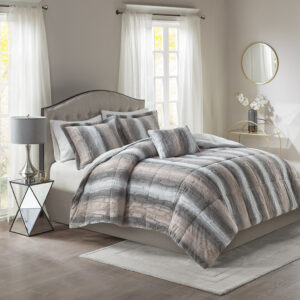 Snuggle up for a luxurious sleep with the Madison Park Zuri Comforter Set. This set features an ultra-soft faux fur front