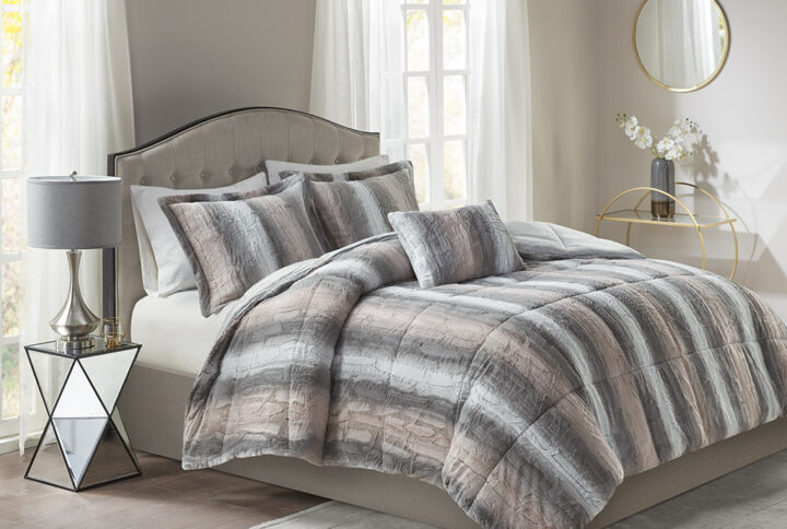 Snuggle up for a luxurious sleep with the Madison Park Zuri Comforter Set. This set features an ultra-soft faux fur front