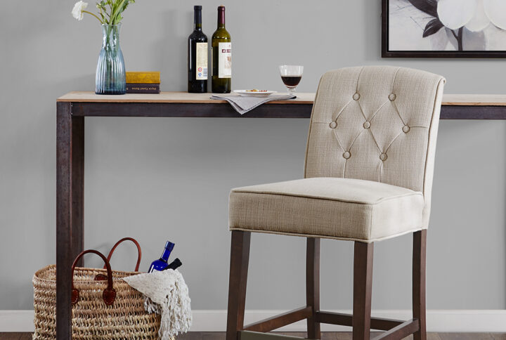 Add a touch of class to your dining decor with the sophisticated Madison Park Marian 26” Tufted Counter Stool. This counter stool uses high-density foam for max comfort that is upholstered in a tan fabric