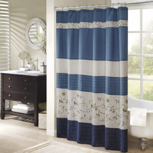 Add an elegant addition to your bathroom with the Madison Park Serene shower curtain. Its rich navy and delicate embroidery are the perfect combination.  This 72x72" shower curtain is machine washable for easy care.Complete the look with coordinating bedding available and sold separately.