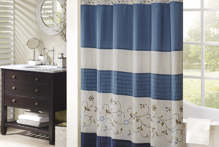 Add an elegant addition to your bathroom with the Madison Park Serene shower curtain. Its rich navy and delicate embroidery are the perfect combination.  This 72x72" shower curtain is machine washable for easy care.Complete the look with coordinating bedding available and sold separately.