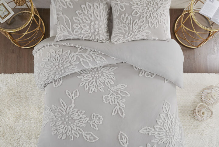 Complete your bedroom decor with the Madison Park Veronica 3 Piece Tufted Chenille Floral Duvet Cover Set. The shabby chic duvet cover features white cotton tufted chenille floral pattern on a warm grey background that creates a lovely contrast. The 2 matching shams mirror the design of the duvet cover to complete the farmhouse aesthetic. Machine washable for easy care