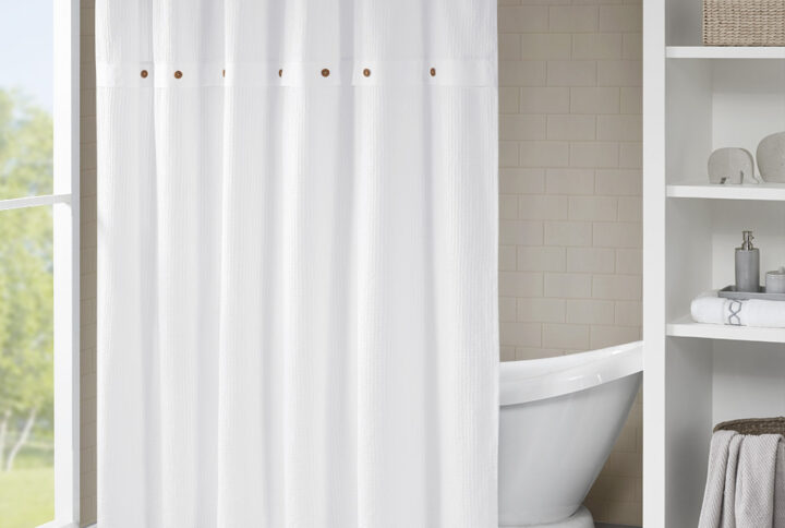 Give your bathroom a simple and stylish update with our Madison Park Finley Cotton Shower Curtain. This crisp white 100% cotton shower curtain features a waffle weave design for beautiful texture and dimension