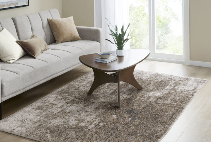 Elevate the style of your living space with the Madison Park Haley Cozy Shag Abstract Area Rug. This soft plush area rug showcases a grey and cream abstract design to create a gorgeous modern look. The super soft