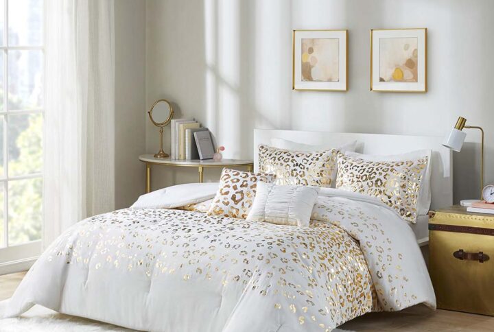 Add a fierce and flashy look to your bedroom with the Intelligent Design Lillie Metallic Animal Printed Comforter Set. The ultra-soft microfiber comforter flaunts a stunning gold metallic animal leopard print on an ivory base