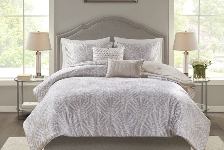 Give your bedroom a luxurious update with the Beautyrest Kiona 5 Piece Crushed Velvet Comforter Set. The oversized champagne crushed velvet comforter set features an art deco pattern for an elegant bedroom style. Embroidered abstract patterns in the square pillow and oblong pillow add the finishing touches to complete the look. Machine washable for easy care