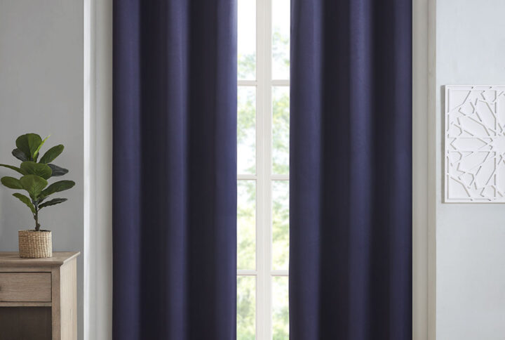 Create the perfect look in your home with the SunSmart Taren Blackout Triple Weave Panel Pair. This solid navy window panel pair features a triple weave to create a significant barrier against outside light and noise intrusion. It also offers considerable energy efficiency and savings with a high level of privacy. Easy to hang with the silver grommet top finish