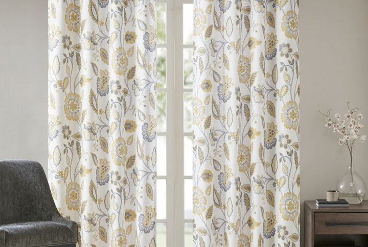 Beautifully frame your window with the stylish and functional SunSmart Camille Printed Room Darkening Curtain. A floral design in deep yellow