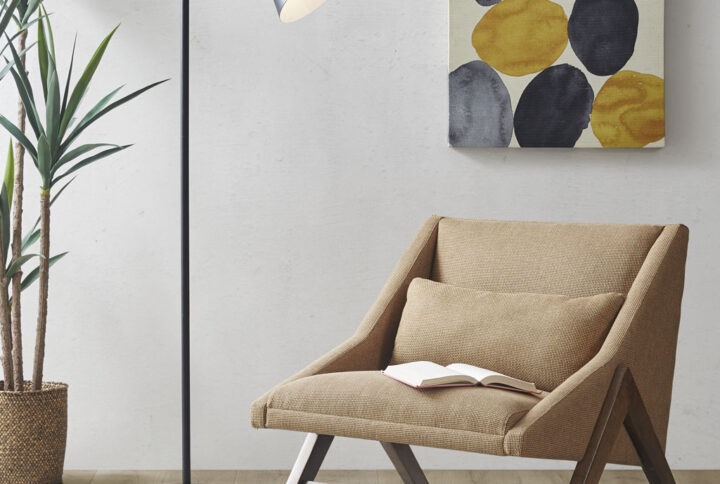 The INK+IVY Beacon Arched Metal Floor Lamp with Chimney Shade provides a refined and sophisticated option to illuminate your living room. This floor lamp features a slender arched neck with a conical shade