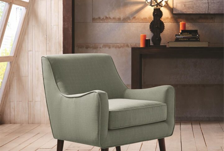 Update your living room with the Madison Park Oxford Mid-Century Accent Chair. Featuring mid-century inspired curves