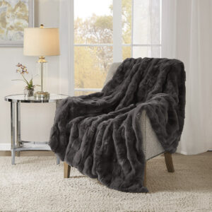 This faux fur throw combines the best of luxury and warmth for your living room. The fur face features a textured basket weave pattern