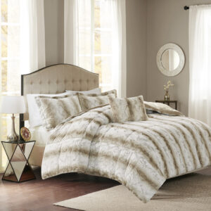 Snuggle up for a luxurious sleep with the Madison Park Zuri Comforter Set. This set features an ultra-soft faux fur front