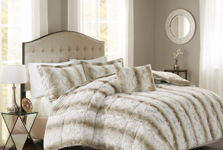 Snuggle up for a luxurious sleep with the Madison Park Zuri Comforter Set. This set features an ultra-soft faux fur front