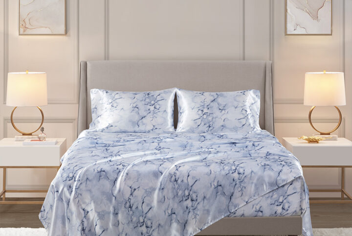 Treat yourself and your bedroom with the elegance of these luxury bed sheets. These wrinkle free satin sheets are silky smooth to the touch and feature a glamorous blue marble print that elevates the style and comfort of your bed. Gentle on your skin and hair