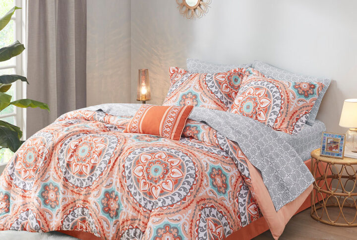 The Madison Park Essentials Serenity Complete Comforter and Cotton Sheet Set provides a fresh globally inspired look for your bedroom. An intricate medallion pattern repeats across the top of bed in brilliant shades of complementary colors to play up the oversized print. An oblong pillow uses decorative embroidery and piecing to create texture on the top of bed. Also included is a complete cotton sheet set that features a coordinating medallion print to complete the look. Bringing the best in health and wellness