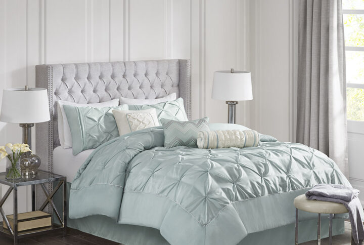 This beautifully tufted bed is from the Laurel bedding collection. Its seafoam coloring makes this set easy to accessorize in your bedroom. The collection is made from 100% polyester polyoni and has pieced fabric sewn together to give this set added dimension. It is finished with a smooth edge of fabric that creates a beautiful border around this comforter. Items in the set may come in a rolled or compressed packaging