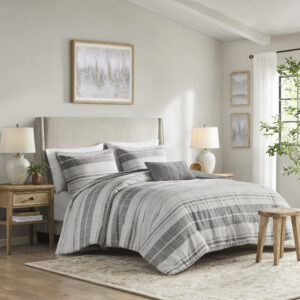 This modern farmhouse bedding set features printed black stripes on a grey and white background made of a cotton/poly slub fabric for a linen-like look. The cotton/poly blend offers softness