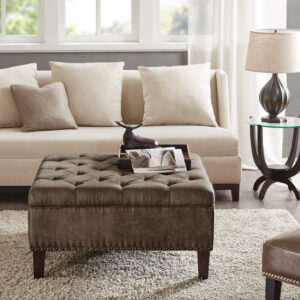 Complete your living space with the Madison Park Lindsey Tufted Square Cocktail Ottoman. This large square ottoman is upholstered fabric and features a button tufted top with piping details to create a chic traditional look. A nail head trim on bottom of the frame adds an elegant touch to the design