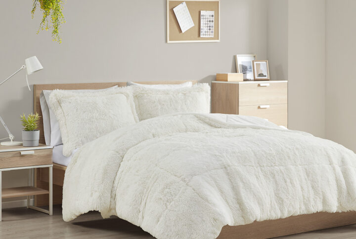 The Intelligent Design Malea Shaggy Long Fur Comforter Mini Set brings a soft contemporary update to your bedroom. The comforter and shams (1 in Twin/TwinXL) feature stylish shaggy faux fur that creates a soft fluffy texture and modern look. The solid plush reverse adds a soft and warm touch. Items in the set may come in a rolled or compressed packaging