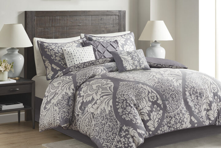 The Madison Park Vienna 7 Piece Cotton Printed Comforter Set offers an eye-catching update to your bedroom decor. A beautifully intricate damask pattern is flaunted across the comforter and shams