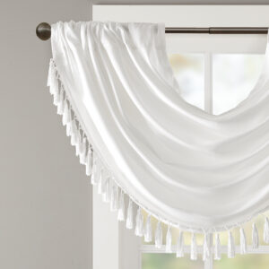 with our Elena Waterfall window valance. This classy white valance showcases rich center draping details and a beautiful tassel trim