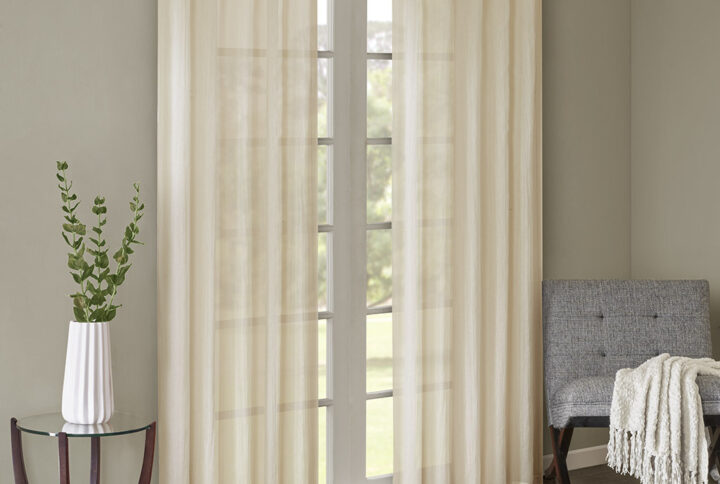 Add a fresh contemporary style to your home with Madison Park’s Harper Solid Crushed Window Panel Pair. Made from a lightweight cream sheer fabric