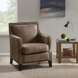 The INK+IVY Shasta Accent Chair introduces a rich and handsome look to your living space. This accent chair is upholstered in faux leather and accented with brass nail buttons