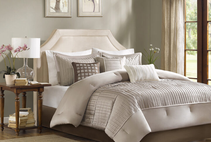 The Madison Park Trinity Collection provides a modern look through fabric manipulation. This beautiful taupe polyester charmeuse gives a slight sheen to this bed while the small pleating on the bottom half of the bed and corresponding shams provides great dimension for your room. Three decorative pillows use embroidery and pleating to bring this beautiful collection together. Items in the set may come in a rolled or compressed packaging