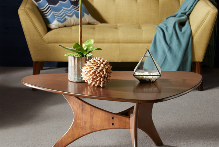 Bring a sleek and refined update to your living room with the INK+IVY Blaze Triangle Wood Coffee Table. This triangular shaped coffee table features a rich pecan wood finish with a unique style base to create a chic mid-century look. Flaunting a gorgeous design