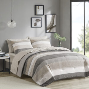 Revamp your bedroom style with the Madison Park Essentials Jaxon bed in a bag. This modern comforter set features a stripe pattern in alternating grey