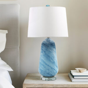 Transform your space with the Aquaviva table lamp from INK+IVY—where artistry meets functionality. Crafted from stunning blue confetti glass