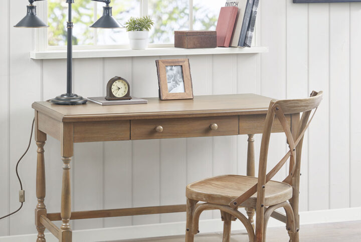 The Martha Stewart Tabitha Desk offers a simple and traditional update to your work space. This wooden desk features a reclaimed natural finish with turned wooden legs that add an elegant touch