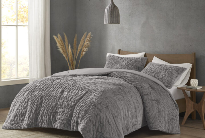 Add glamorous style and comfort to your bedroom with the Madison Park Blair Down Alt Ruched Faux Fur Comforter Set. This stylish comforter will liven up your bedroom with its unique texture and beauty. The face features a luxuriously soft faux fur with a stunning ruched design and a solid microfiber reverse. This bedding set includes 1 hypoallergenic polyester filled comforter and 2 shams to complete the look. This comforter set is also OEKO-TEX certified