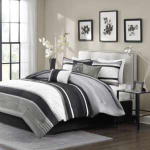 The Madison Park Blaire 7 Piece Comforter Set offers a rich traditional update to your bedroom decor. The comforter and matching shams feature pieced lustrous silk fabric and pintucking details