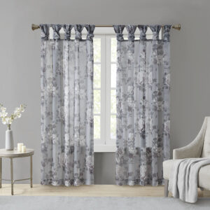 The Madison Park Simone Printed Floral Twist Tab Top Voile Sheer brings a soft and romantic touch to your home decor. This voile sheer curtain panel features a beautiful mauve and neutral printed floral on a dark grey ground for a rich and stylish contrast