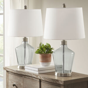 Update your living room or bedroom with the sleek style of the 510 Design Harmony Angular Glass Table Lamp