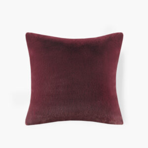 The face of the pillow flaunts a premium luxury faux fur