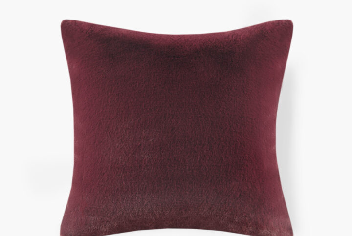 The face of the pillow flaunts a premium luxury faux fur