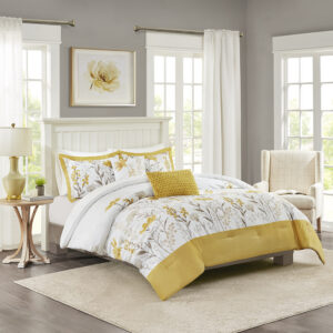 The Harbor House Meadow 5 Piece Cotton Comforter Set offers a charming farmhouse style update for your bedroom decor. This cotton sateen comforter features a botanic print in taupe and yellow hues on a white ground and a yellow border at the foot