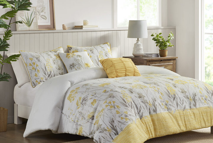 Featuring a floral print on a white ground and a yellow border at the foot