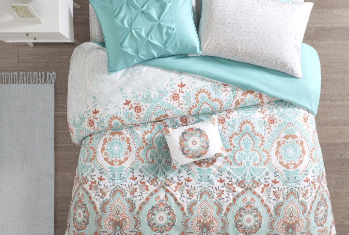 The Intelligent Design Vinnie Boho Comforter Set with Bed Sheets offers a fun and fashionable update your bedroom. Flaunting a vibrant aqua and orange globally inspired pattern